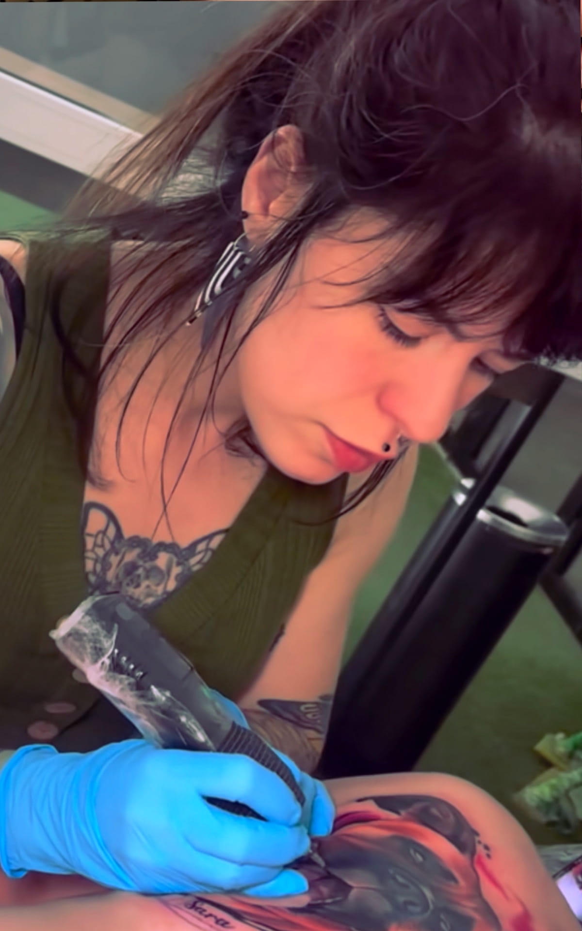 Laura Egea Tattoing a client – professional color realism artist in Dallas
