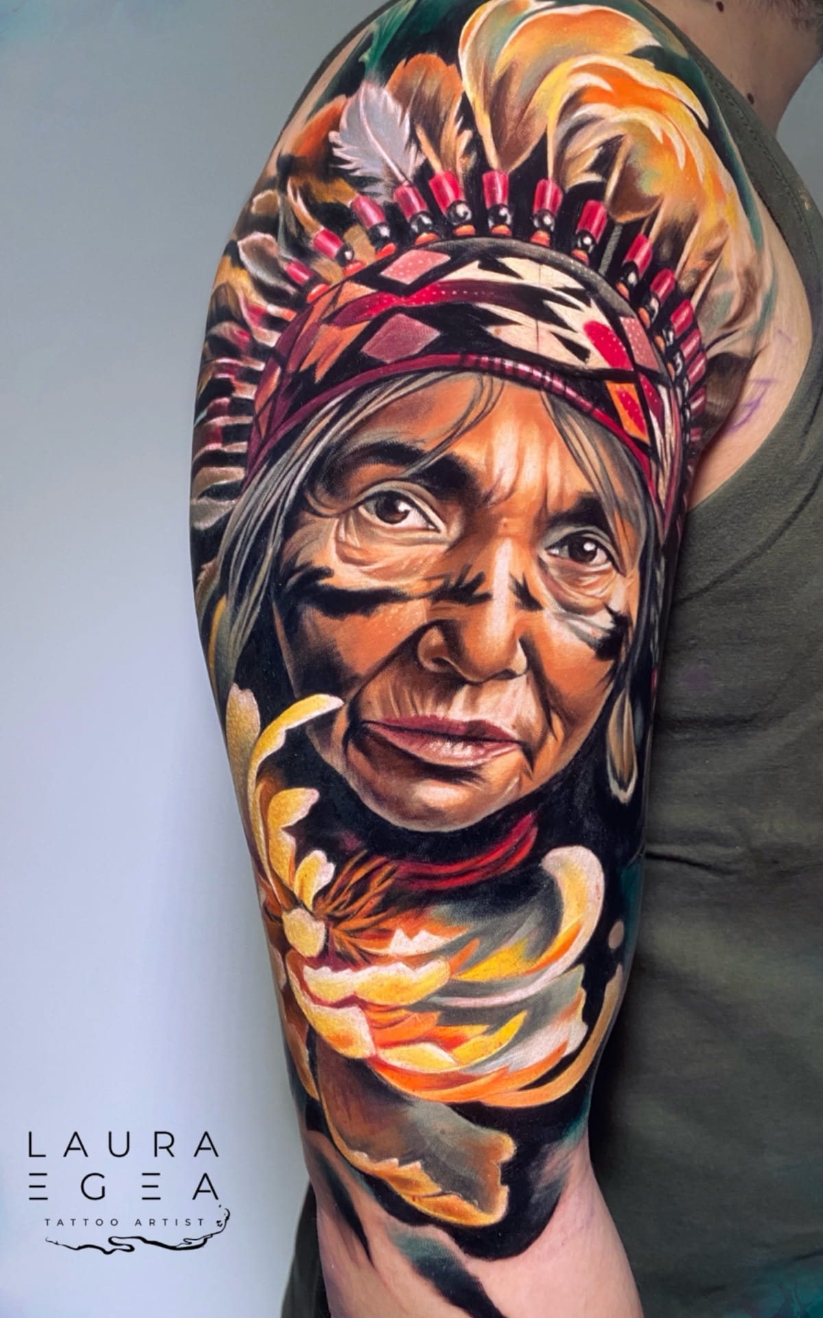 Color realism tattoo by Laura Egea featuring detailed shading, vibrat tones, and artistic composition