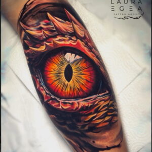 Fantasy dragon eye tattoo very detailed and high contrast by Laura Egea international tattoo artist Laura Egea based in Texas USA