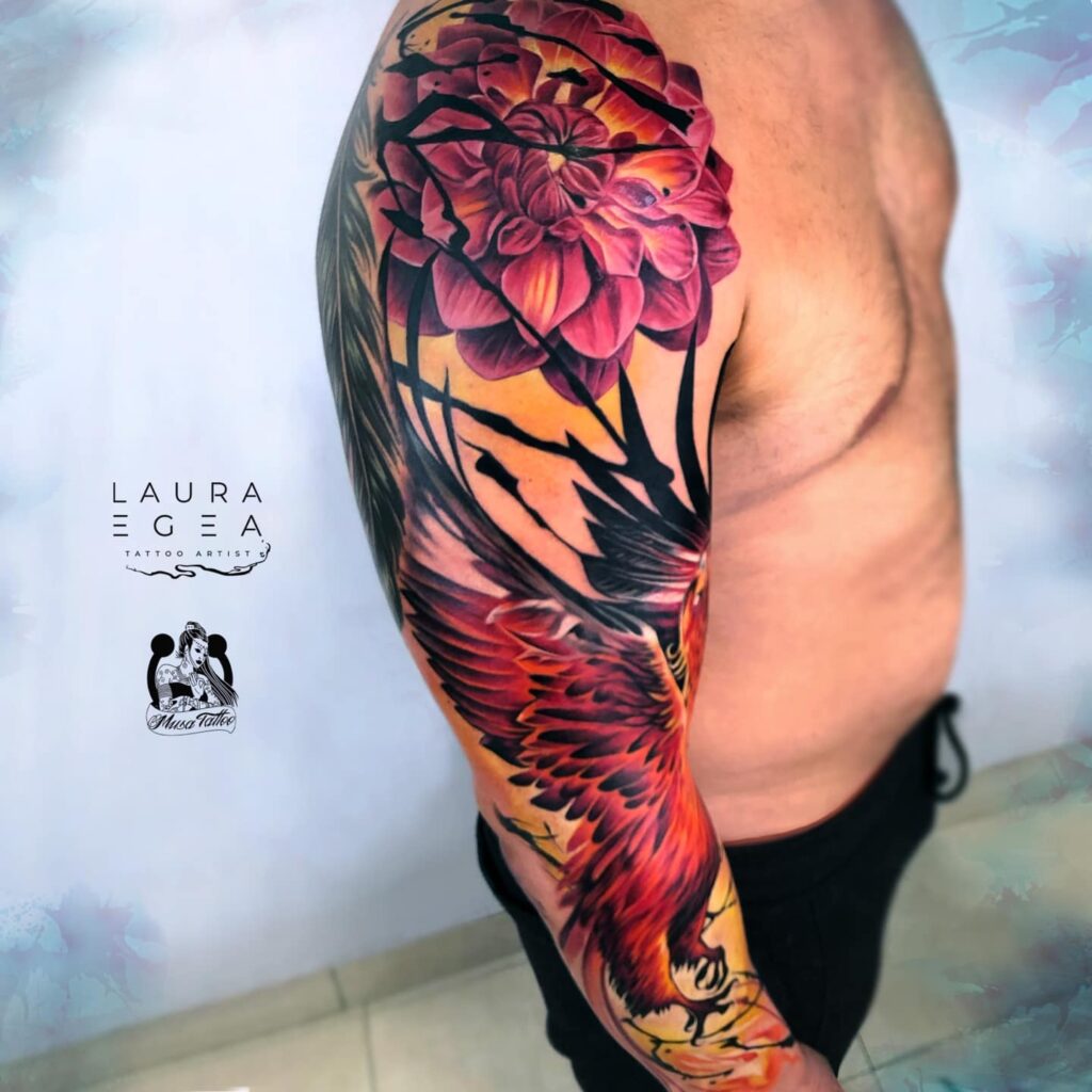 large scale phoenix sleeve tattoo with floral elements by Laura Egea Dallas Texas