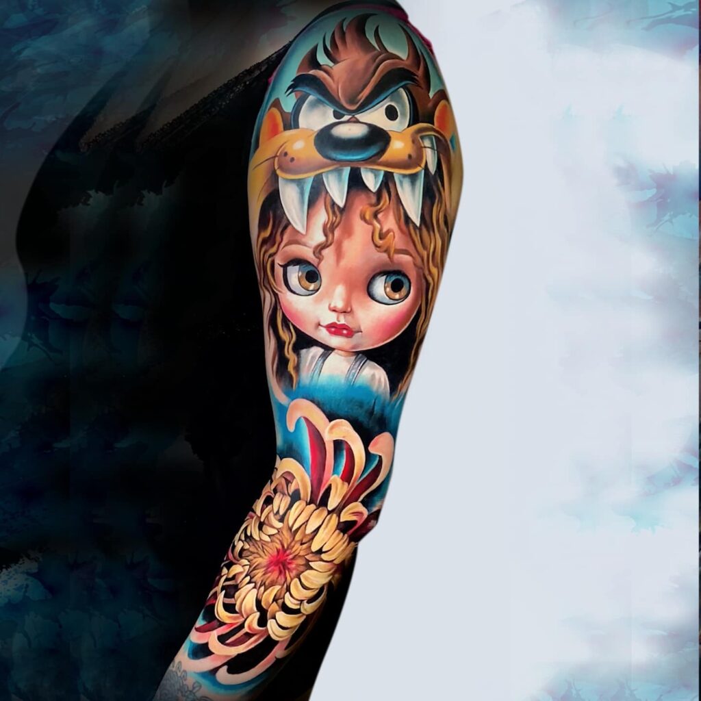 Fantasy doll tattoo with cartoon inspired character and floral elements by Laura Egea Texas