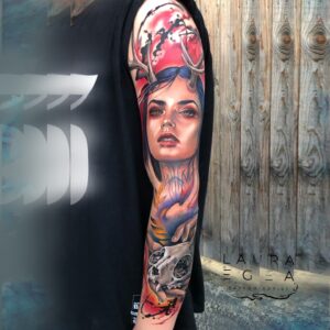 Female portrait tattoo with skull symbolism in color realism by Laura Egea Texas