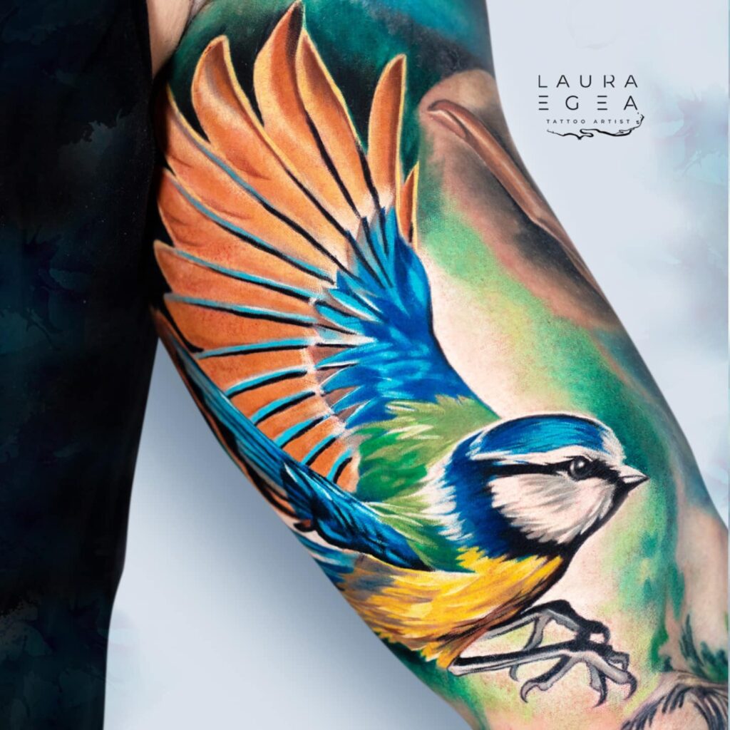 realistic bird tattoo with soft color gradients by Laura Egea Dallas Texas