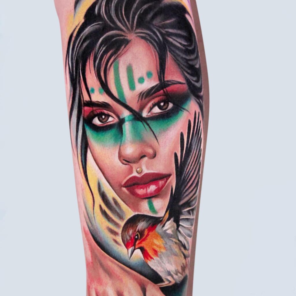 Color realism female portrait tattoo with painted face and bird by laura Egea Dallas Texas