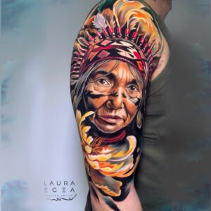 Indigenous elder female portrait tattoo sleeve with flowers by Laura Egea Texas